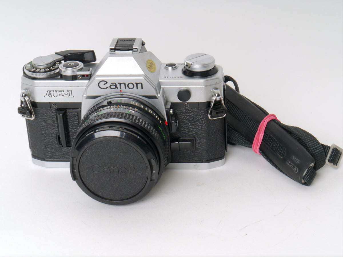 Canon AE-1 Gehäuse Chrom mit FD 1,8/50mm – Gut