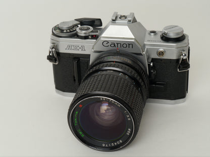 Canon AE-1 Gehäuse Silber mit Tokina MF 3,5/35-70mm – gut