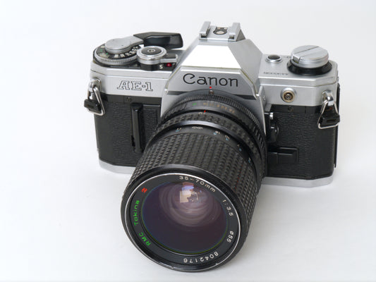 Canon AE-1 Gehäuse Silber mit Tokina MF 3,5/35-70mm – gut