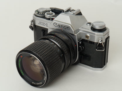 Canon AE-1 Gehäuse Silber mit Tokina MF 3,5/35-70mm – gut