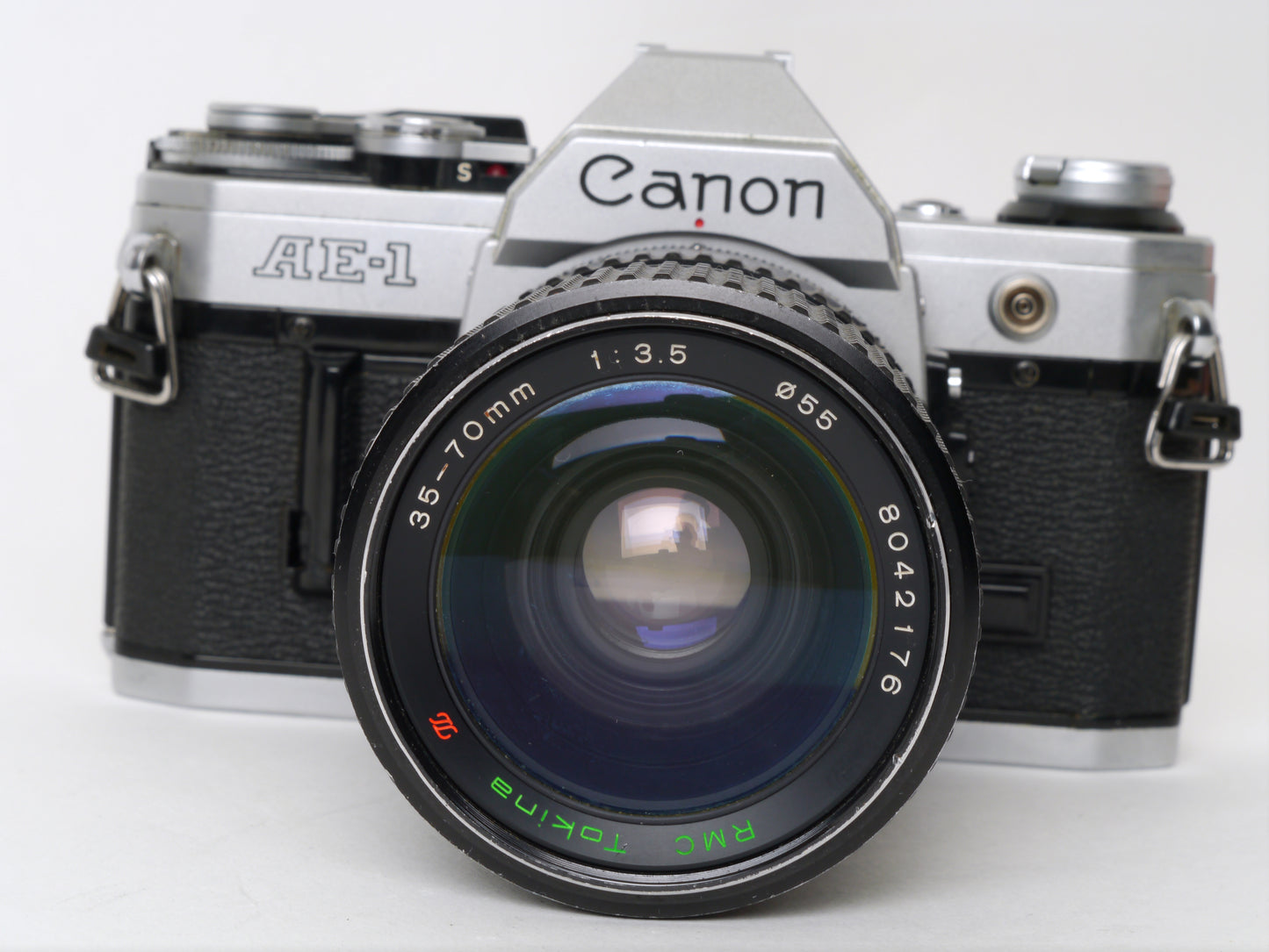 Canon AE-1 Gehäuse Silber mit Tokina MF 3,5/35-70mm – gut