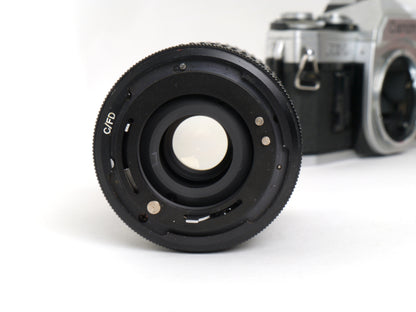 Canon AE-1 Gehäuse Silber mit Tokina MF 3,5/35-70mm – gut
