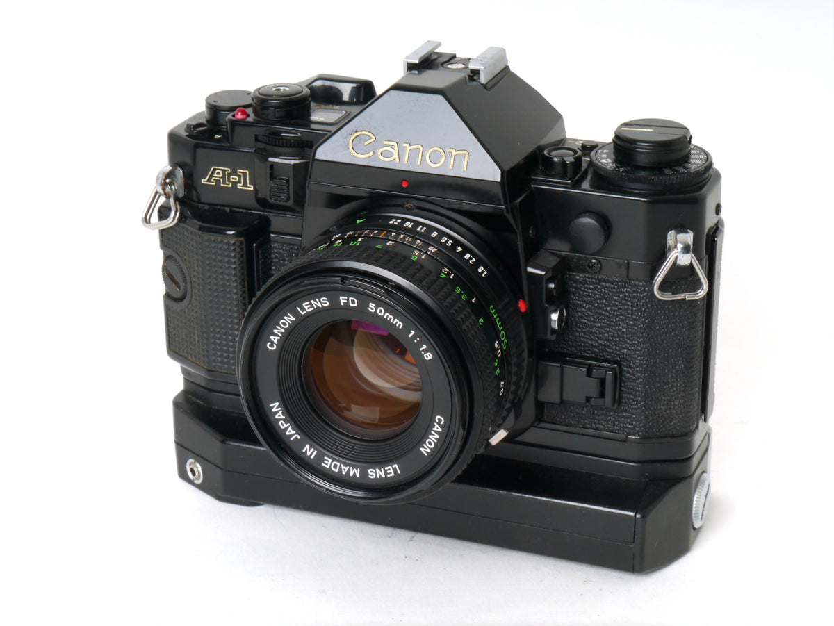 Canon A-1 Gehäuse mit FD 1,8/50mm und Power Winder A2 – Sehr gut