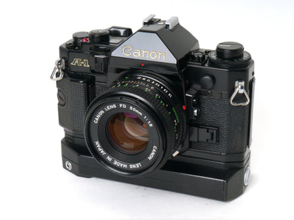 Canon A-1 Gehäuse mit FD 1,8/50mm und Power Winder A2 – Sehr gut
