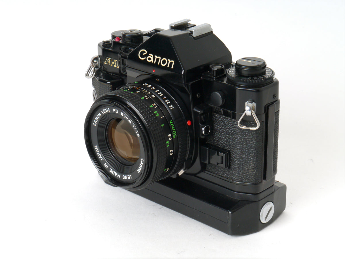 Canon A-1 Gehäuse mit FD 1,8/50mm und Power Winder A2 – Sehr gut