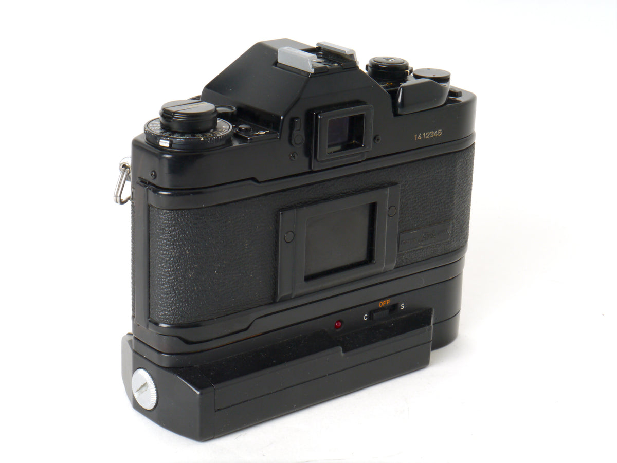 Canon A-1 Gehäuse mit FD 1,8/50mm und Power Winder A2 – Sehr gut