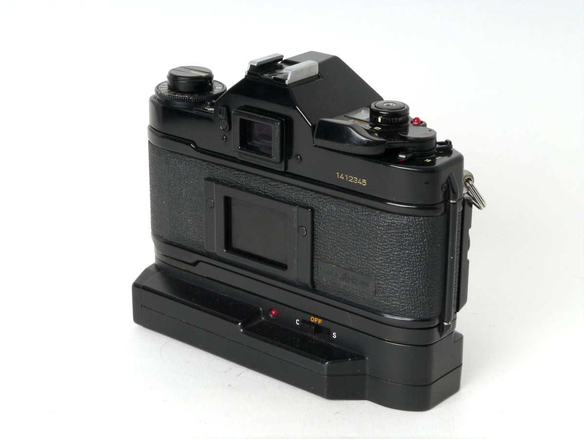 Canon A-1 Gehäuse mit FD 1,8/50mm und Power Winder A2 – Sehr gut