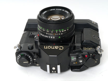 Canon A-1 Gehäuse mit FD 1,8/50mm und Power Winder A2 – Sehr gut
