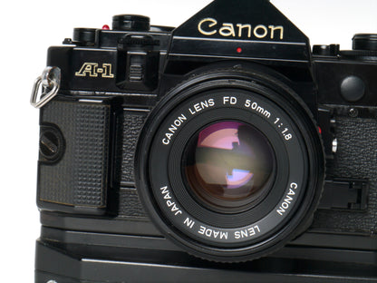 Canon A-1 Gehäuse mit FD 1,8/50mm und Power Winder A2 – Sehr gut