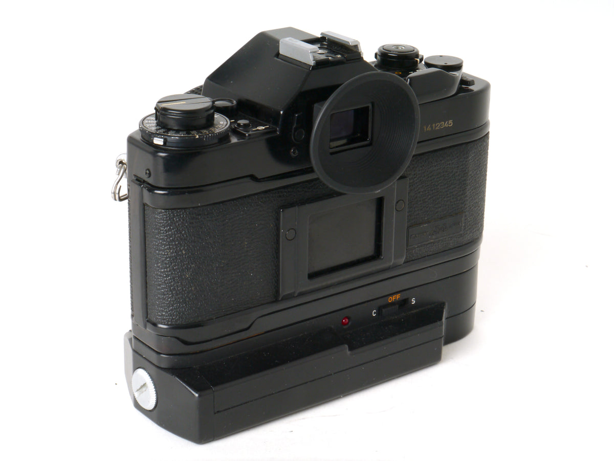 Canon A-1 Gehäuse mit FD 1,8/50mm und Power Winder A2 – Sehr gut