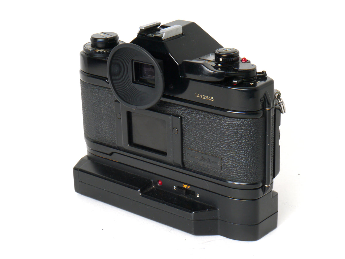 Canon A-1 Gehäuse mit FD 1,8/50mm und Power Winder A2 – Sehr gut
