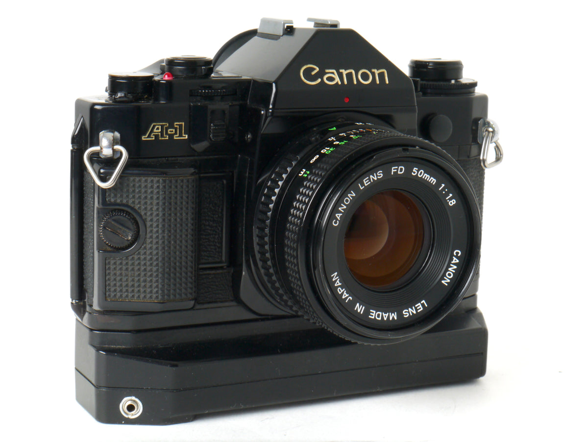 Canon A-1 Gehäuse mit FD 1,8/50mm und Power Winder A2 – Sehr gut