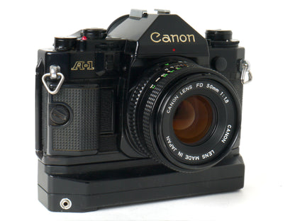 Canon A-1 Gehäuse mit FD 1,8/50mm und Power Winder A2 – Sehr gut