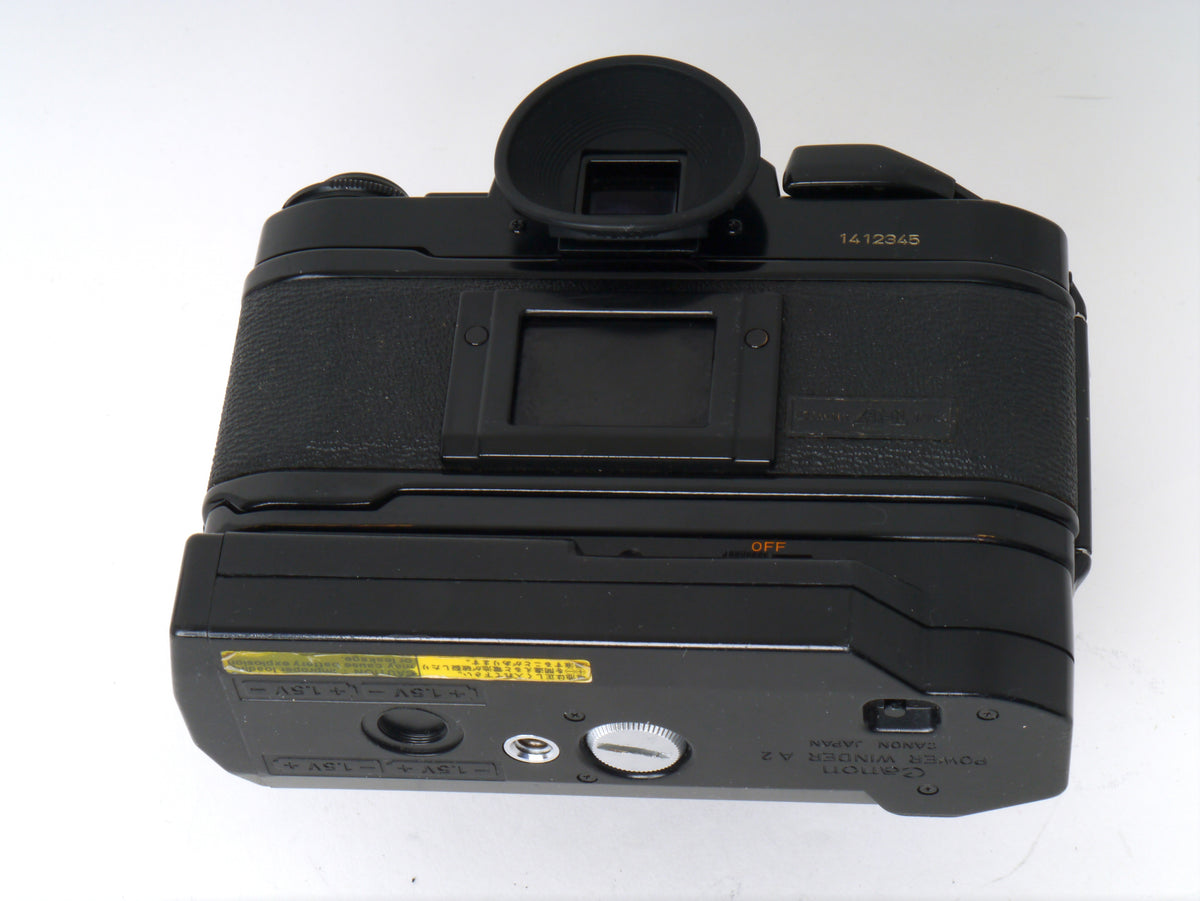 Canon A-1 Gehäuse mit FD 1,8/50mm und Power Winder A2 – Sehr gut