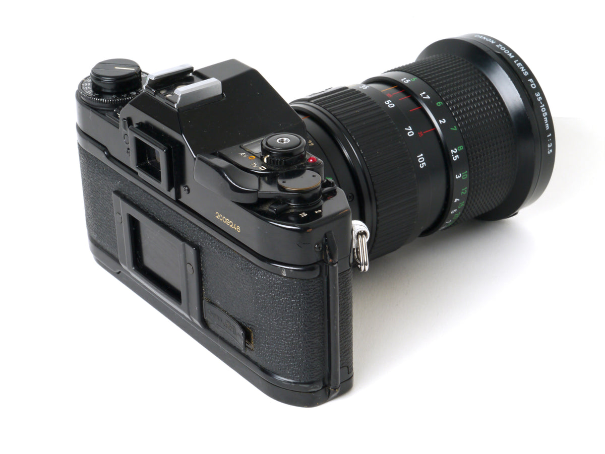 Canon A-1 Gehäuse mit FD 3,5/35-105mm – Gut