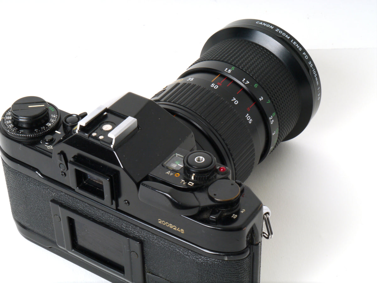 Canon A-1 Gehäuse mit FD 3,5/35-105mm – Gut