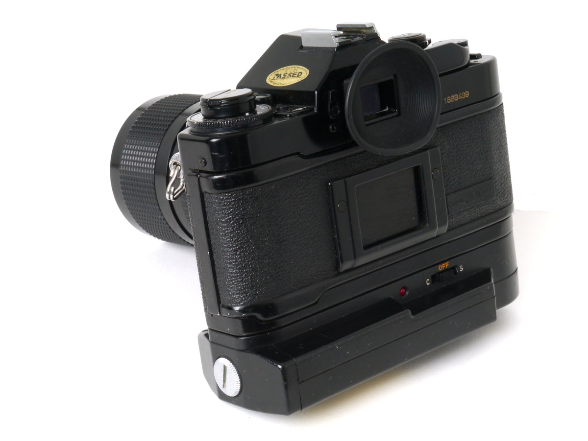 Canon A-1 Gehäuse mit FD 4/35-70mm und Power Winder A2 – Gut