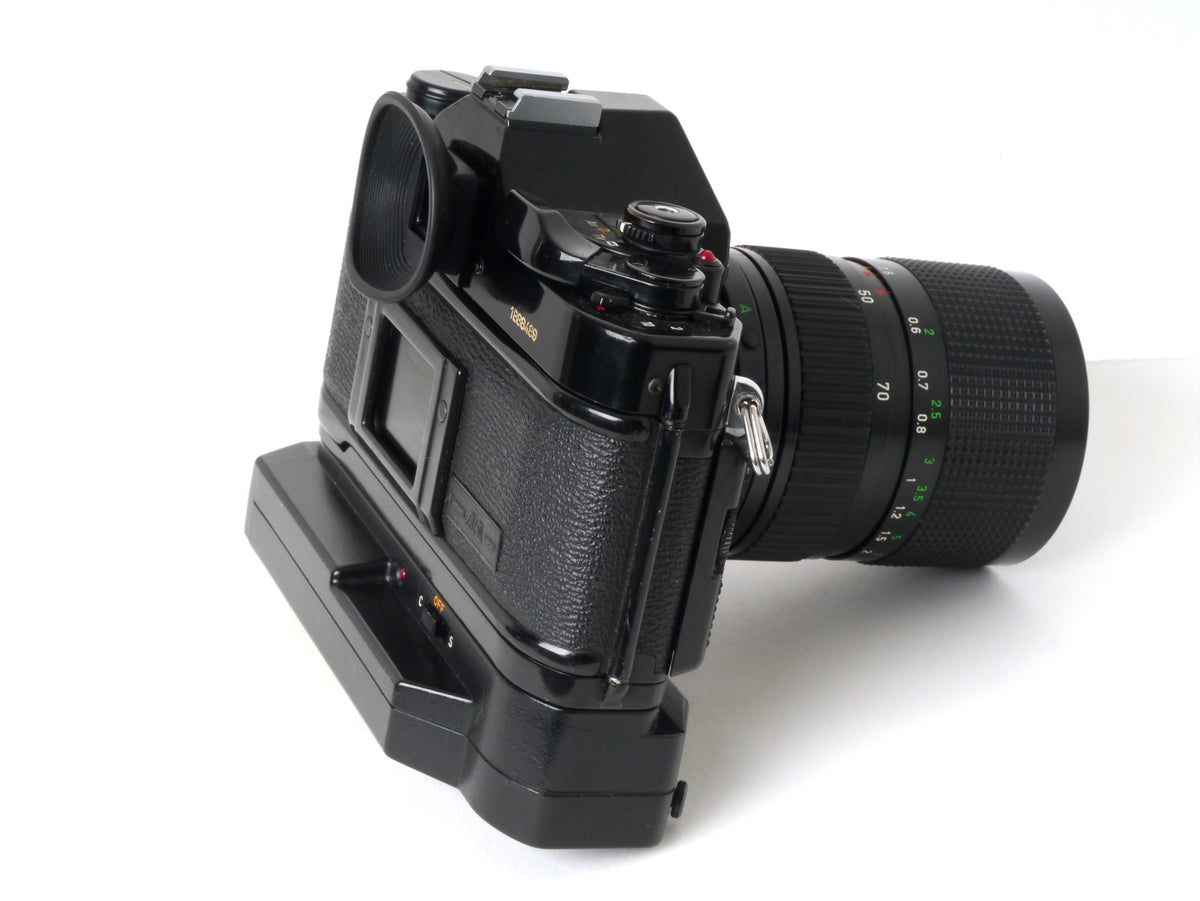 Canon A-1 Gehäuse mit FD 4/35-70mm und Power Winder A2 – Gut