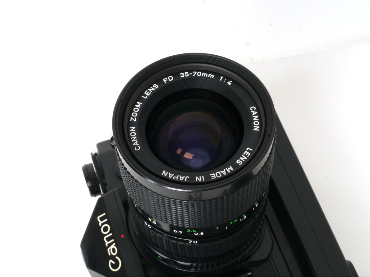 Canon A-1 Gehäuse mit FD 4/35-70mm und Power Winder A2 – Gut