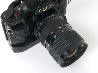 Canon A-1 Gehäuse mit FD 4/35-70mm und Power Winder A2 – Gut