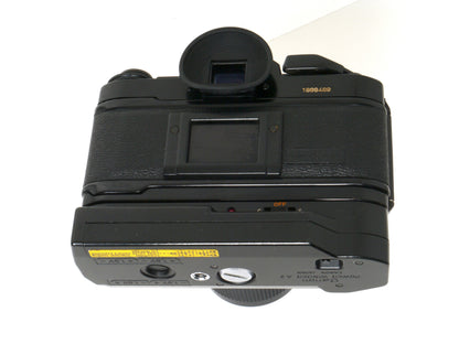 Canon A-1 Gehäuse mit FD 4/35-70mm und Power Winder A2 – Gut