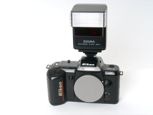 Nikon F-401 Gehäuse mit Sigma Flash 280 NA Blitzgerät – Sehr gut